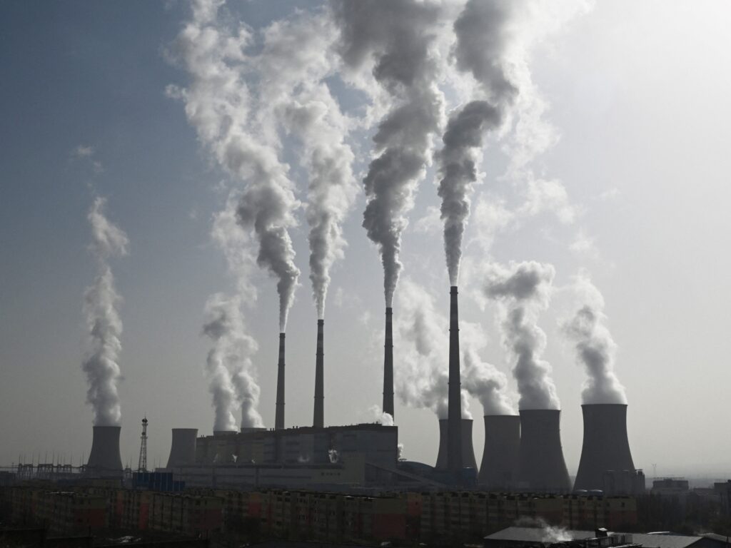 This photo taken on November 15, 2021 shows the coal-powered Datang International Zhangjiakou Power Station in Zhangjiakou, one of the host cities for the 2022 Winter Olympic Games, in China's northern Hebei province. - China is the world's biggest producer of wind turbines and solar panels, and the Winter Olympics is seen as an opportunity to showcase the countrys green technologies as they seek global markets. - TO GO WITH China-rights-environment-energy,FEATURE by Poornima WEERASEKARA (Photo by GREG BAKER / AFP) / TO GO WITH China-rights-environment-energy,FEATURE by Poornima WEERASEKARA (Photo by GREG BAKER/AFP via Getty Images)