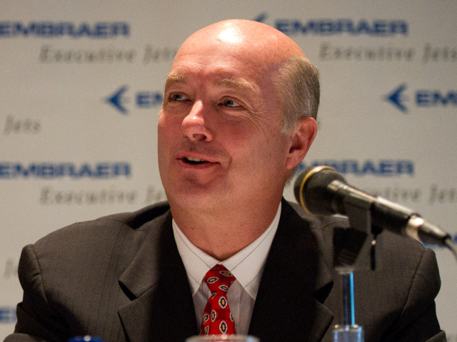 David Sokol, chairman and chief executive officer of NetJets Inc., right, speaks while Frederico Curado, president and chief executive officer of Empresa Brasileira de Aeronautica SA, listens during a news conference at the National Business Aviation Association annual meeting in Atlanta, Georgia, U.S., on Monday, Oct. 18, 2010. The business-jet …