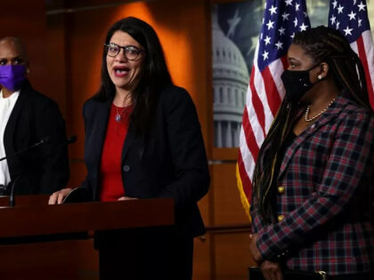 WASHINGTON, DC - DECEMBER 08: U.S. Rep. Rashida Tlaib (D-MI) (2nd L) becomes emotional as she speaks as Rep. Ayanna Pressley (D-MA) (L) and Rep. Cori Bush (D-MO) (R) look on during a news conference at the U.S. Capitol December 8, 2021 in Washington, DC. House Democrats held the news …