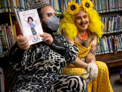 Chelsea, MA - June 25: Drag queens Just JP, left, and Sham Payne read stories to children during a Drag Story Hour at Chelsea Public Library in Chelsea, MA on June 25, 2022. In the past few months, many drag queens have experienced increased fear and threats. (Photo by Erin …