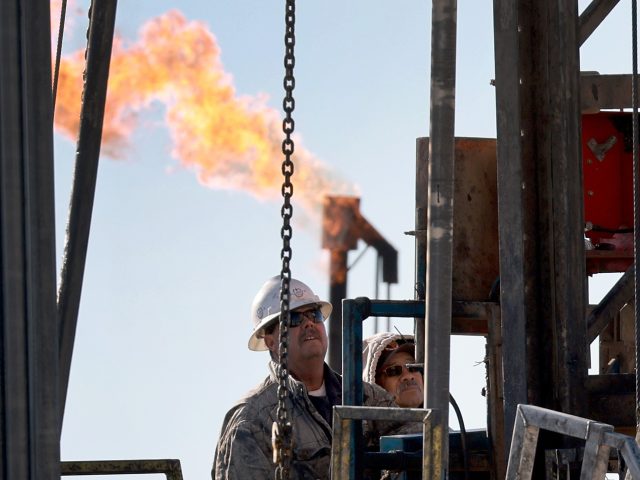 MIDLAND, TEXAS - MARCH 12: Workers place pipe into the ground on an oil drilling rig set up in the Permian Basin oil field on March 12, 2022 in Midland, Texas. President Joe Biden imposed a ban on Russian oil, the world’s third-largest oil producer, which may mean that oil …
