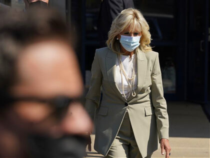 First lady Jill Biden walks to talk to the media about President Joe Biden testing positive for COVID-19, as she arrives to visit Schulze Academy, Thursday, July 21, 2022, in Detroit. (AP Photo/Carlos Osorio)