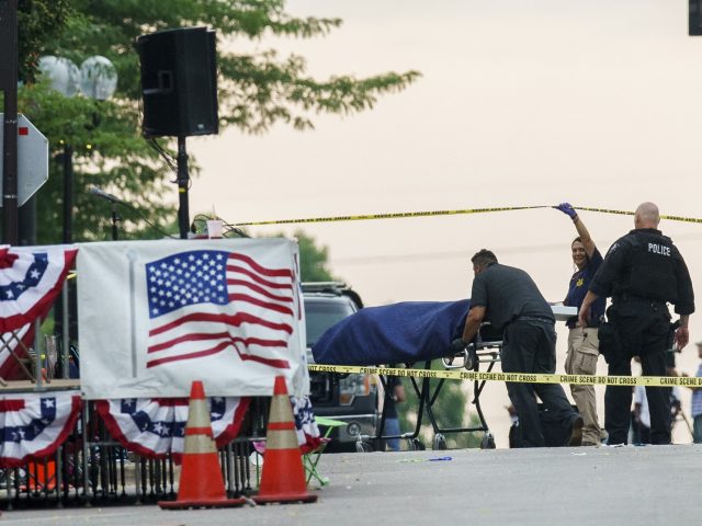 A body is transported from the scene of a mass shooting during the July 4th holiday weekend Monday, July 4, 2022, in Highland Park, Ill. (Armando L. Sanchez/Chicago Tribune/Tribune News Service via Getty Images)