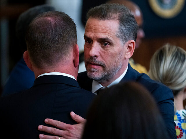 UNITED STATES - JULY 7: Hunter Biden, right, the son of President Joe Biden, greets Labor Secretary Marty Walsh during a ceremony to present the Presidential Medal of Freedom, the nation's highest civilian honor, to 17 recipients at the White House on Thursday, July 7, 2022. (Tom Williams/CQ-Roll Call, Inc …