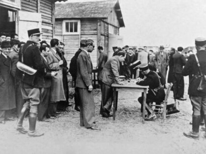 Picture taken on May 1941 at Pithiviers showing foreign Jews who get registered by French policemen after their arrival in the transit camp. These registration was the beginning of the deportation process towards the extermination camps in Germany and in East Europe. (Photo by AFP) (Photo by -/AFP via Getty …