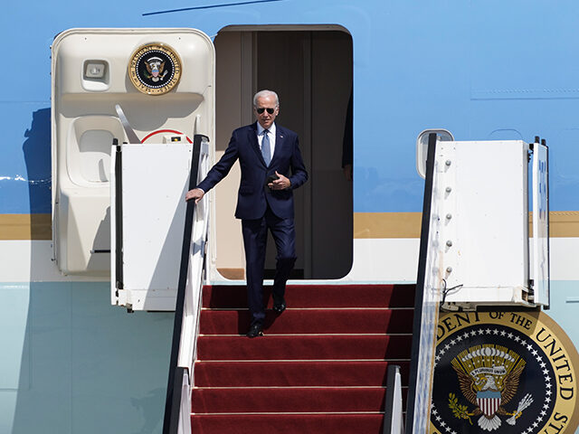 President Joe Biden walk down the steps of Air Force One upon his arrival at Ben Gurion In