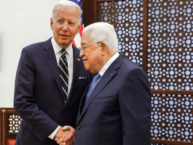 US President Joe Biden (L) is received by Palestinian president Mahmud Abbas (R) during a welcome ceremony at the Palestinian Muqataa Presidential Compound in the city of Bethlehem in the occupied West Bank on July 15, 2022. (Photo by MOHAMAD TOROKMAN / POOL / AFP) (Photo by MOHAMAD TOROKMAN/POOL/AFP via …
