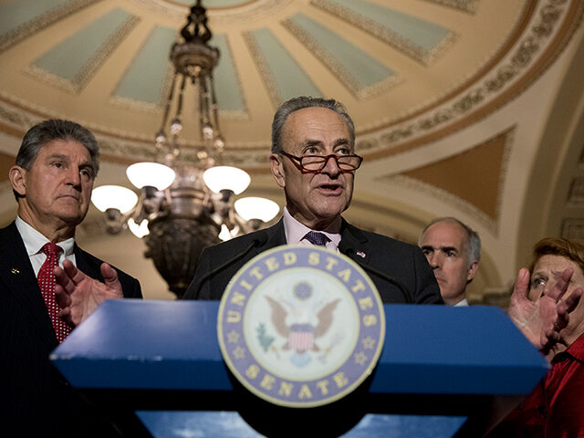 WASHINGTON, DC - MAY 2: Senate Minority Leader Chuck Schumer, flanked by Sen. Joe Manchin (D-WV), Sen. Bob Casey (D-PA) and Sen. Heidi Heitkamp (D-ND), speaks to the media after the weekly policy luncheon on Capitol Hill May 2, 2017 in Washington, DC. Democrats discussed the recent spending bill that …