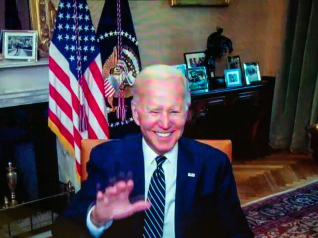 WASHINGTON, DC July 26, 2022: US President Joe Biden waves following a virtual meeting wit