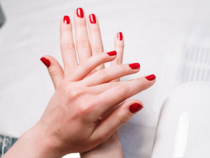 Person With Red Nail Polish