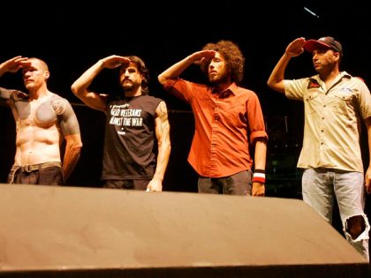 FILE - Members of the band Rage Against the Machine salute veterans during an anti-war concert at the Democratic National Convention in Denver, in this Aug. 27, 2008 file photo. Seen from left to right, Tom Morello, Brad Wilk, Zack de la Rocha and Tim Commerford. The politically outspoken rap-rock …