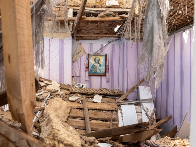 UKRAINE - 2022/07/11: The portrait of Jesus Christ is in a church destroyed by Russian she