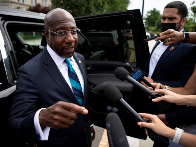 UNITED STATES - June 09: Sen. Raphael Warnock, D-Ga., talks with reporters after speaking at a rally, hosted by the Declaration for American Democracy coalition, calling on the Senate to pass the For the People Act, outside the Supreme Court in Washington on Wednesday, June 9, 2021. (Photo by Caroline …