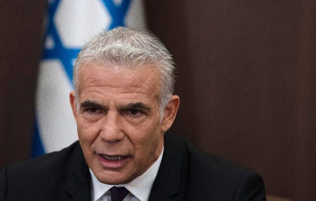Israeli Prime Minister Yair Lapid makes a statement at the start of the weekly cabinet mee