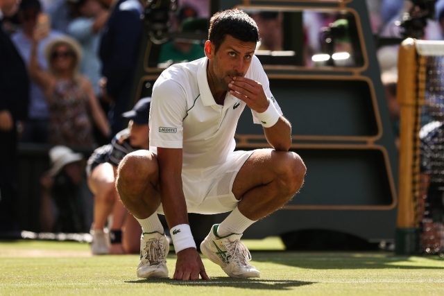 Novak Djokovic celebrates his Wimbledon triumph by eating the grass on Centre Court