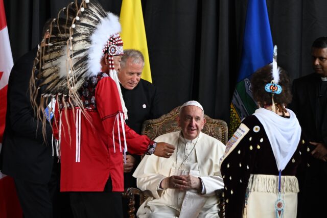 Pope Francis speaks with George Arcand (L), grand chief of the Confederacy of Treaty Six F