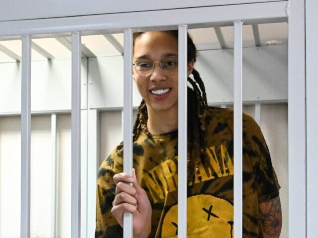 US WNBA basketball superstar Brittney Griner smiles inside a defendants' cage during a hearing in the town of Khimki outside Moscow on July 15, 2022