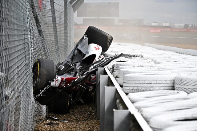 Zhou Guanyu escapes serious injury after hurtling over the barrier in a horror crash at Si