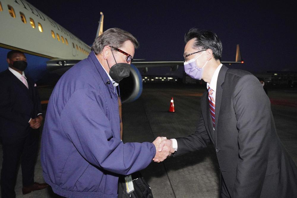In this photo released by the Taiwan Ministry of Foreign Affairs, from left, U.S. Democratic House members John Garamendi shakes hands with Donald Yu-Tien Hsu, Director-General, dept. of North American Affairs, Taiwan's Ministry of Foreign Affairs after arriving on a U.S. government plane at Songshan airport in Taipei, Taiwan on Sunday, Aug 14, 2022. The delegation of American lawmakers are visiting Taiwan just 12 days after a visit by U.S. House Speaker Nancy Pelosi that angered China. (Taiwan Ministry of Foreign Affairs via AP)