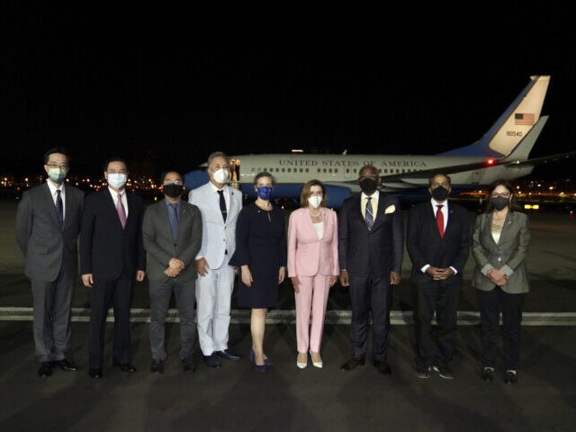 In this photo released by the Taiwan Ministry of Foreign Affairs, U.S. House Speaker Nancy Pelosi, center pose for photos after she arrives in Taipei, Taiwan, Tuesday, Aug. 2, 2022. Pelosi arrived in Taiwan on Tuesday night despite threats from Beijing of serious consequences, becoming the highest-ranking American official to …