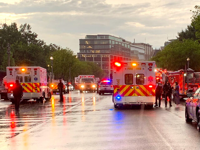 In this photo provided by @dcfireems, emergency medical crews are staged on Pennsylvania Avenue between the White House and Lafayette Park, Thursday evening, Aug. 4, 2022 in Washington. Two people who were critically injured in a lightning strike in Lafayette Park outside the White House have died, police said Friday. …