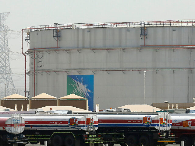 FILE - Fuel trucks line up in front of storage tanks at the North Jiddah bulk plant, an Ar
