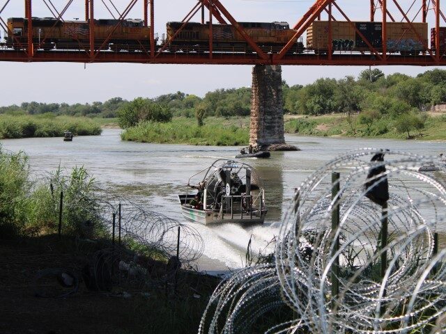 Border Patrol and Texas Army National Guard Boats Patrol Rio Grande at Eagle Pass