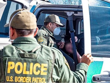 Border Patrol agents arrest a group of migrants. (File Photo: U.S. Border Patrol)