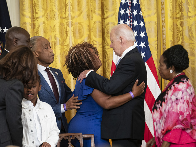 U.S. President Joe Biden hugs Breonna Taylor's mother, Tamika Palmer, after signing an executive order modifying the policy on the use of force by federal law enforcement in the East Room of the White House in Washington, D.C., U.S., Wednesday, May 25, 2022. On the second anniversary of the death of George Floyd at the hands of Minneapolis police, Biden signed an order that will impose new requirements on all federal law enforcement agencies, including restrictions on bomb bans and ban throttling lock up. Photographer: Sarah Silbiger/Bloomberg via Getty Images