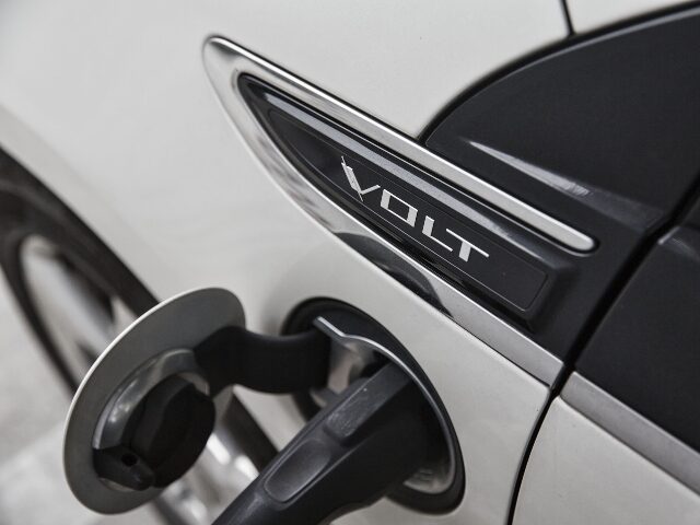 A charging plug is attached to a General Motors Co. (GM) Chevrolet Volt electric vehicle (