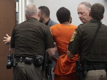 Darrell Brooks Jr. is removed from court after arguing with the judge and deputies Friday, Aug. 26, 2022, in Waukesha County Court in Waukesha, Wisconsin. Brooks is accused of killing six people and injuring dozens more when he drove an SUV through a suburban Christmas parade.(Mark Hoffman/Milwaukee Journal-Sentinel via AP, …