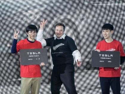 SHANGHAI, Jan. 7, 2020 -- Tesla CEO Elon Musk poses with Tesla China-made Model 3 vehicle owners during a ceremony in Shanghai, east China, Jan. 7, 2020. U.S. electric carmaker Tesla officially launched its China-made Model Y program in its Shanghai gigafactory Tuesday, one year after the company broke ground …