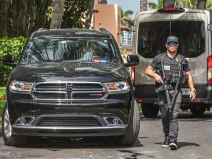 A member of the Secret Service is seen in front of the home of former President Donald Tru