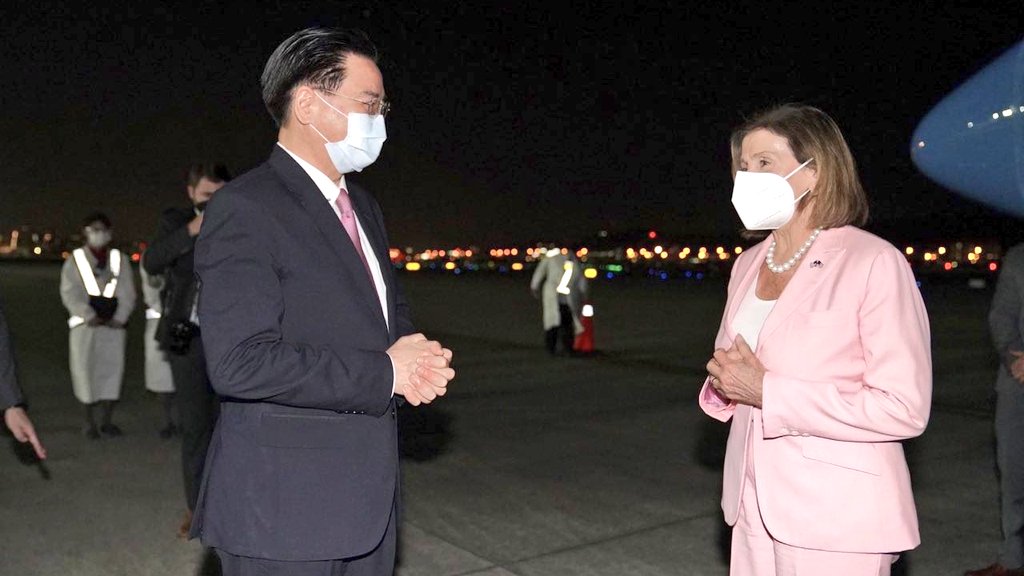 House Speaker Nancy Pelosi (R) is welcomed by Taiwan's Foreign Minister Joseph Wu (L) after landing at Songshan Airport in Taipei, Taiwan on August 2, 2022. (Photo by Taiwan Ministry of Foreign Affairs/Handout)