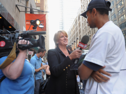 NEW YORK, NY - AUGUST 30: CNN anchor Felicia Taylor interviews a fan at DC Comics’ Midnight Madness Event celebrating the release of New No. 1 issue of "Justice League" at Mid Town Comics on August 30, 2011 in New York City. (Photo by Michael Loccisano/Getty Images for DC Comics)