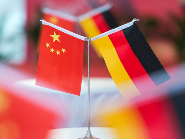 The national flags of China and Germany are on display on tables during a reception in Hef