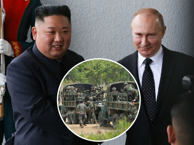 Kim Jong Un, North Korea's leader, left, shakes hands with Vladimir Putin, Russia's presid