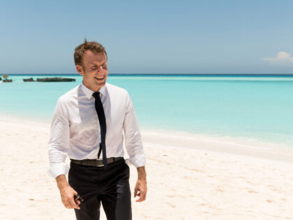 TOPSHOT - French President Emmanuel Macron walks along the beach during his visit to the French island of la Grande Glorieuse, part of Les Glorieuses Islands in the Eparses archipelago, 250km northeast of the French Indian Ocean island of Mayotte, on October 23, 2019. - Macron announced that the island, …