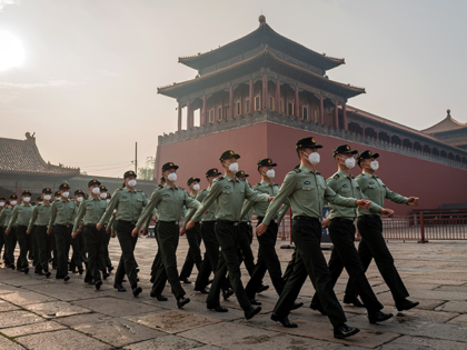 People's Liberation Army (PLA) soldiers march next to the entrance to the Forbidden City during the opening ceremony of the Chinese People's Political Consultative Conference (CPPCC) in Beijing on May 21, 2020. - China's biggest political event of the year, the National People's Congress (NPC), opens on May 22 after …