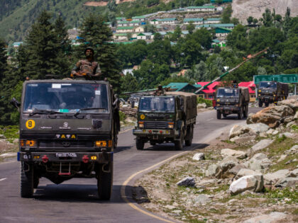 GAGANGIR, KASHMIR, INDIA - JUNE 19: An Indian army convoy drives towards Leh, on a highway bordering China, on June 19, 2020 in Gagangir, India. As many as 20 Indian soldiers were killed in a "violent face-off" with Chinese troops on Tuesday in the Galwan Valley along the Himalayas. Chinese …