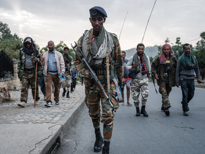 Tigray People's Liberation Front (TPLF) fighters arrive after eight hours of walking in Mekele, the capital of Tigray region, Ethiopia, on June 29, 2021. - Rebel fighters in Ethiopia's war-hit Tigray seized control of more territory on June 29, 2021, one day after retaking the local capital and vowing to …