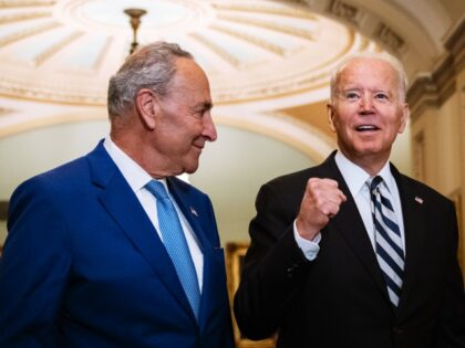 WASHINGTON, DC - JULY 14: Senate Majority Leader Chuck Schumer (D-NY) and U.S. President Joe Biden speak briefly to reporters as they arrive at the U.S. Capitol for a Senate Democratic luncheon July 14, 2021 in Washington, DC. President Biden is on the Hill to discuss with Senate Democrats the …