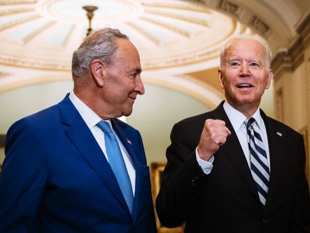 WASHINGTON, DC - JULY 14: Senate Majority Leader Chuck Schumer (D-NY) and U.S. President Joe Biden speak briefly to reporters as they arrive at the U.S. Capitol for a Senate Democratic luncheon July 14, 2021 in Washington, DC. President Biden is on the Hill to discuss with Senate Democrats the …