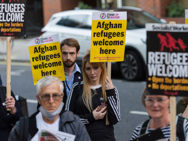 LONDON, UNITED KINGDOM - AUGUST 23, 2021: Demonstrators including Afghan people protest ou