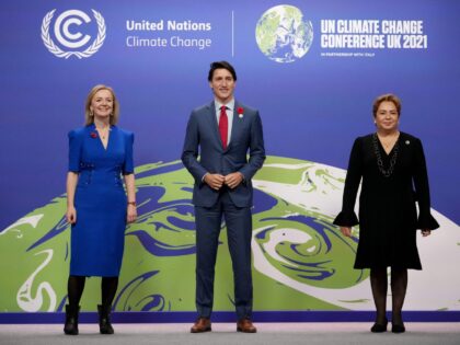 Britain's Foreign Secretary Liz Truss (L) and United Nations Framework Convention on Clima