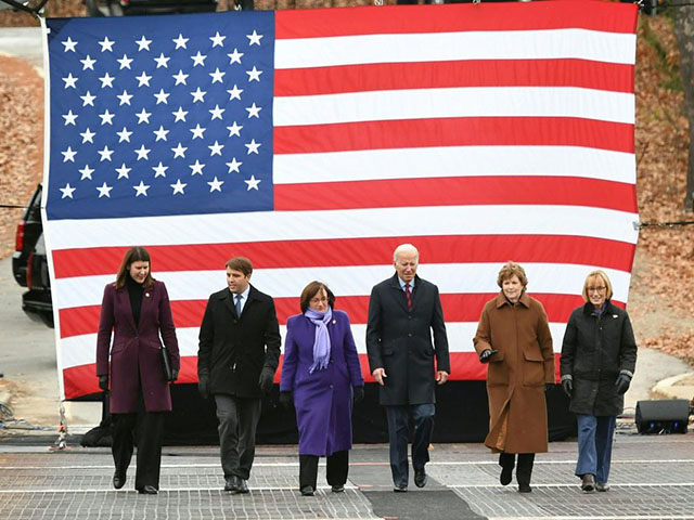 US President Joe Biden flanked by Senator Jeanne Shaheen (D-NH) (2nd R), Senator Maggie Hassan (D-NH) (R), Representative Annie Kuster(D-NH)(3rd L), Representative Chris Pappas (D-NH)(2nd L)and New Hampshire Department of Transportation Commissioner Victoria Sheehan (L), tours the NH 175 bridge over the Pemigewasset River in Woodstock, New Hampshire on November 16, 2021. (Photo by MANDEL NGAN / AFP) (Photo by MANDEL NGAN/AFP via Getty Images)