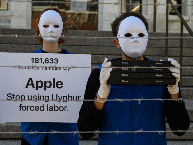Activist set up a mock Uyghur forced labor camp outside the Apple flagship store on March 4, 2022, in Washington, DC. - Demonstrators called on tech giant Apple to stop using Uyghur forced labor. (Photo by Nicholas Kamm / AFP) (Photo by NICHOLAS KAMM/AFP via Getty Images)