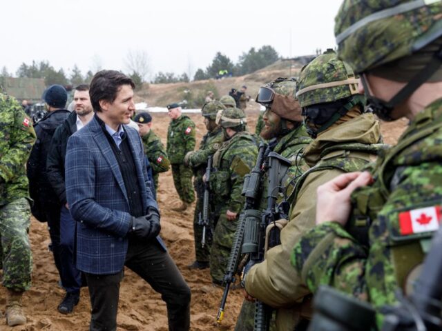 Canada's Prime minister Justin Trudeau talks with soldiers during a visit of the Adazi military base, north east of Riga, Latvia, on March 8, 2022. (Photo by Toms Norde / AFP) (Photo by TOMS NORDE/AFP via Getty Images)