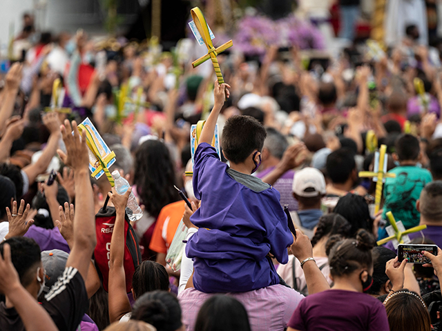 Catholic parishioners attend a mass prior to the traditional procession of the Nazareno de