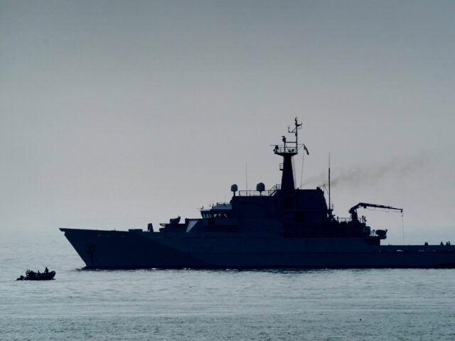 Royal Navy patrol ship HMS Tyne with her support vessel on patrol in the Channel off the c